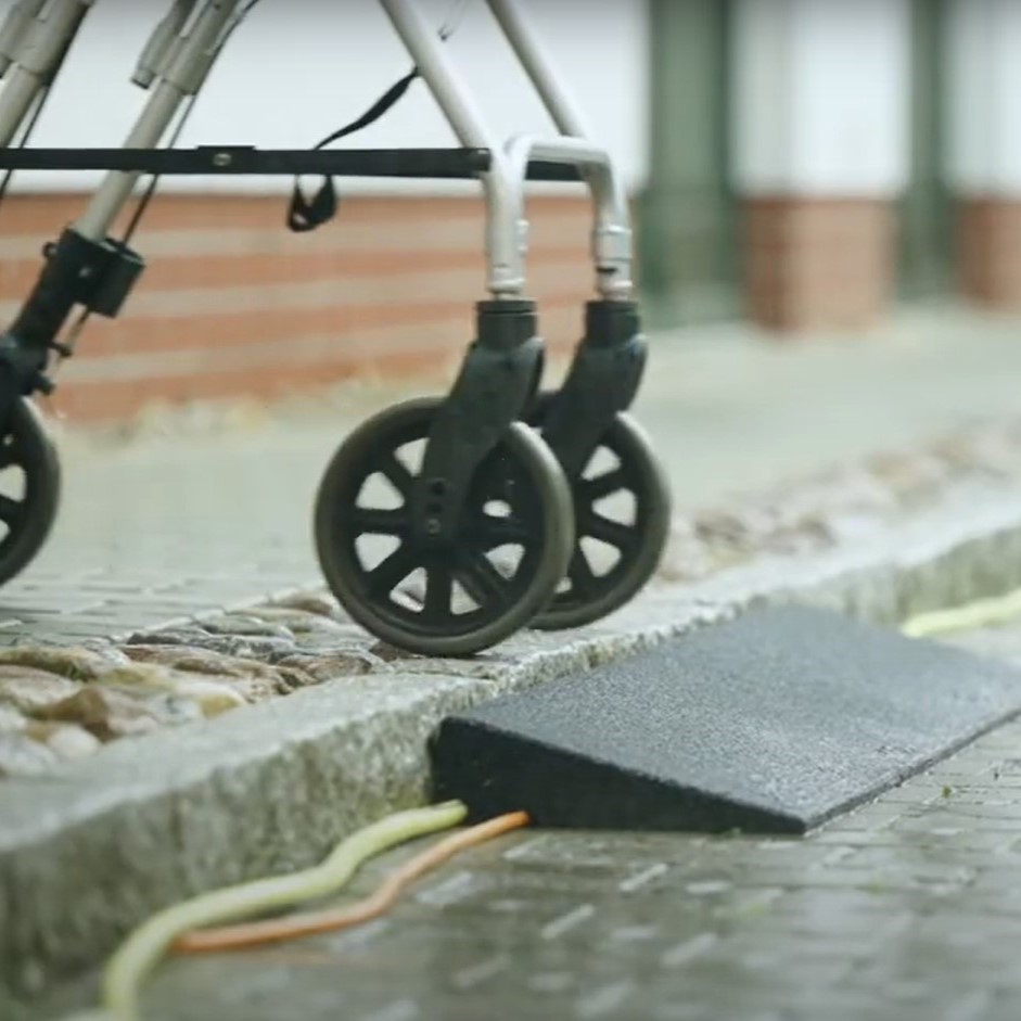 Rollator uses the rubber kerb ramp.