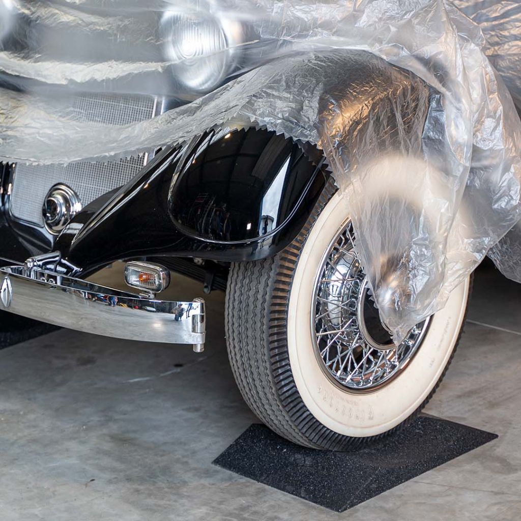 Oldtimer stands on tire cradle to avoid flat spots.